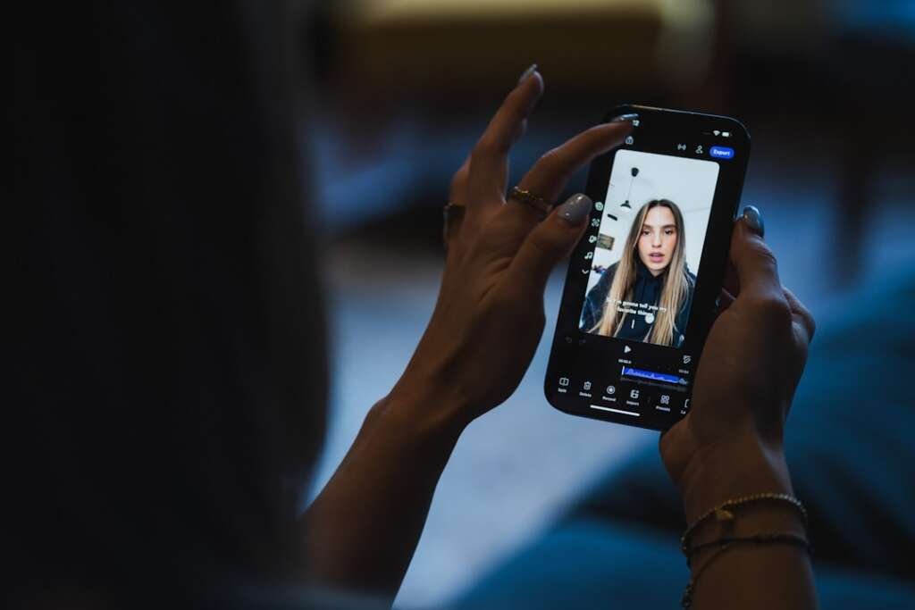 Person watching video on smartphone screen of smartphone
